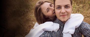 teen couple, girl with arm around boy's neck